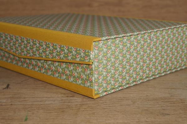 Modern crate with a hinged lid with an interesting design